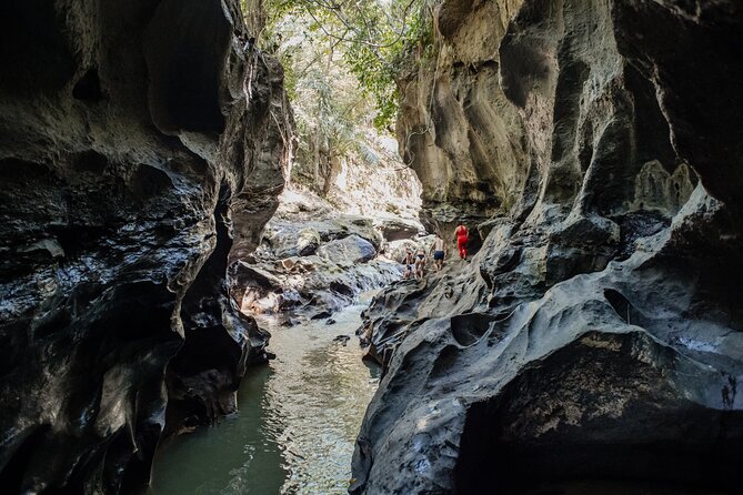 Bali Adventure Tour: Hidden Canyon, Tegenungan Waterfall, Goa Gajah temple - Getting there from Seminyak with pickup, an English guide, and A/C