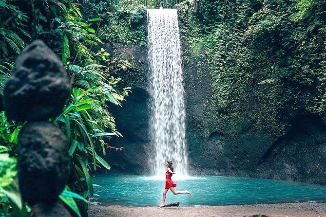 Bali Day Trip: Ubud Temples & Hidden Waterfalls - Stop 2: Kanto Lampo Waterfall and Its Smaller, Quieter Feel