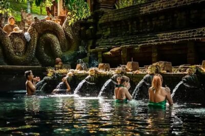 Best of Ubud: Waterfalls, Temple & Rice Terraces Private Day Tour - Kanto Lampo Waterfall: rocks, water, and great phone angles