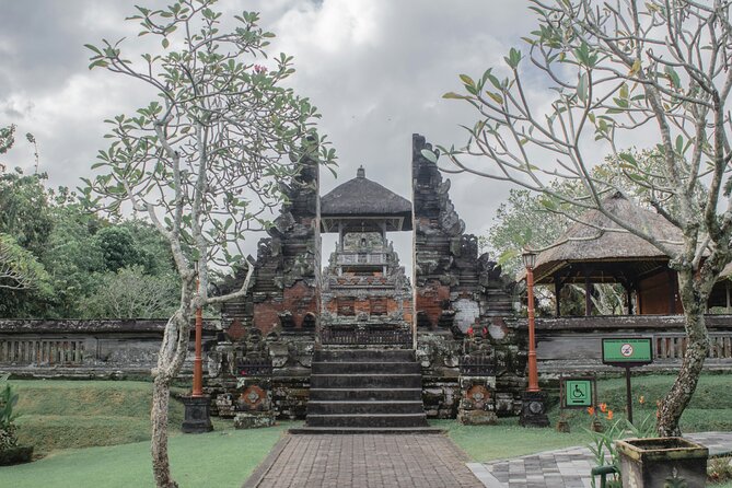 Full Day Private Tour to Ubud Waterfall and Tanah Lot Sunset - Taman Ayun Temple: garden calm before the sea-rock spectacle