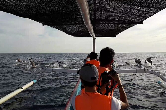 Lovina Sunrise Dolphin with option snorkeling and waterfall - The waterfall trio in one day: Tibumana, Tukad Cepung, Kanto Lampo