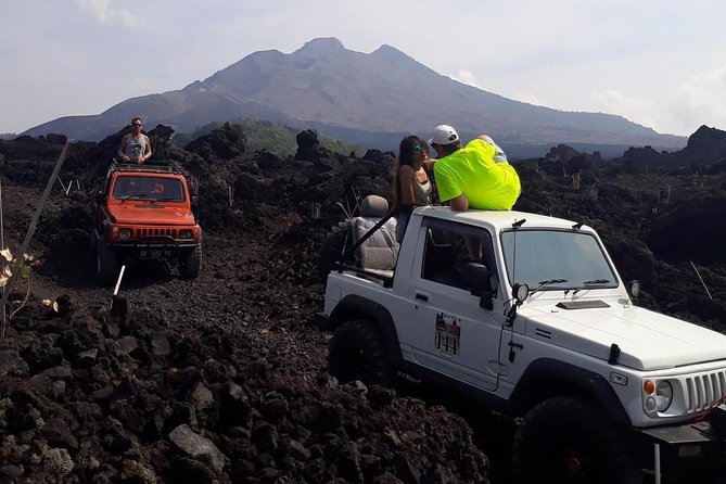 Mount Batur Jeep Sunrise & Overnight Glamping Experience - Exploring black lava and sand fields by Jeep