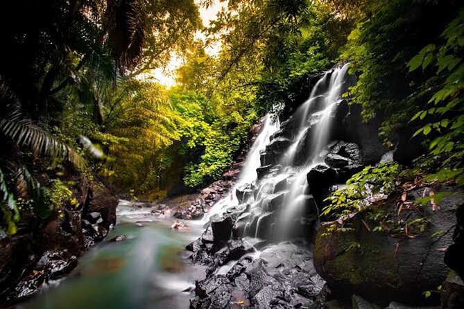 Private Day Tour To Waterfalls And Ubud Sightseeing - Kanto Lampo Waterfall: terraced rocks and easygoing photo time