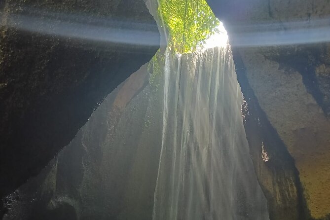 The Fantastic East Of Bali Private Guided Tour - Stop 3: Tukad Cepung Waterfall, a cave walk with big photo payoff