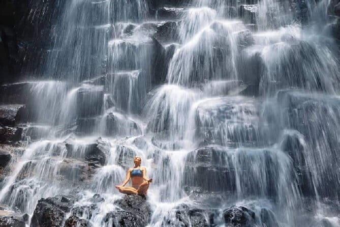 Ubud Full Day - Monkey Forest, Rice Terrace and Waterfalls Tour - Kanto Lampo Waterfall: the face-wash moment and rocky photo spots